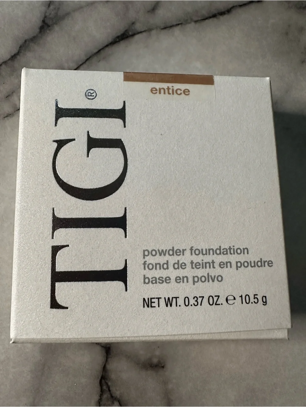 TIGI Compact Pressed Setting Powder color- Entice, black liquid eyeliner